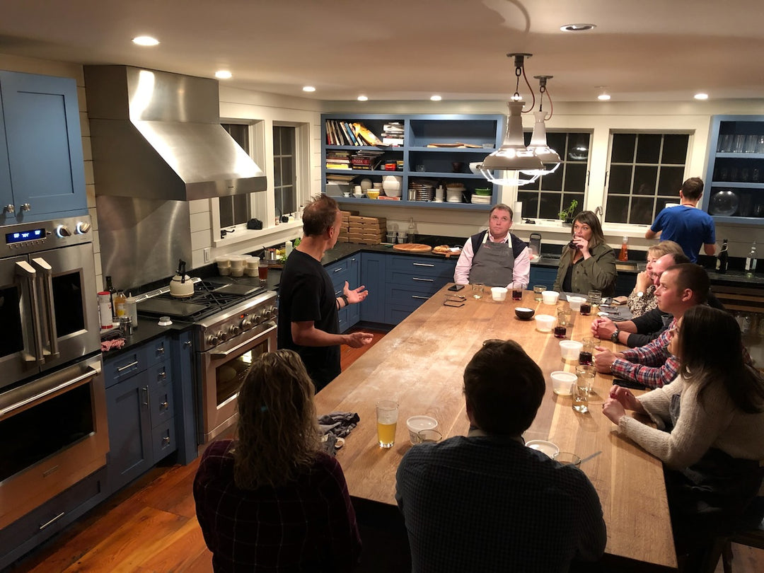 Baking Steel used for cooking pizza on a stovetop-style setup